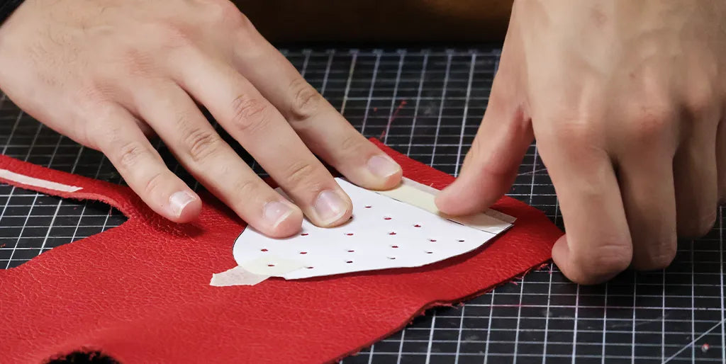 glue the pattern to the leather