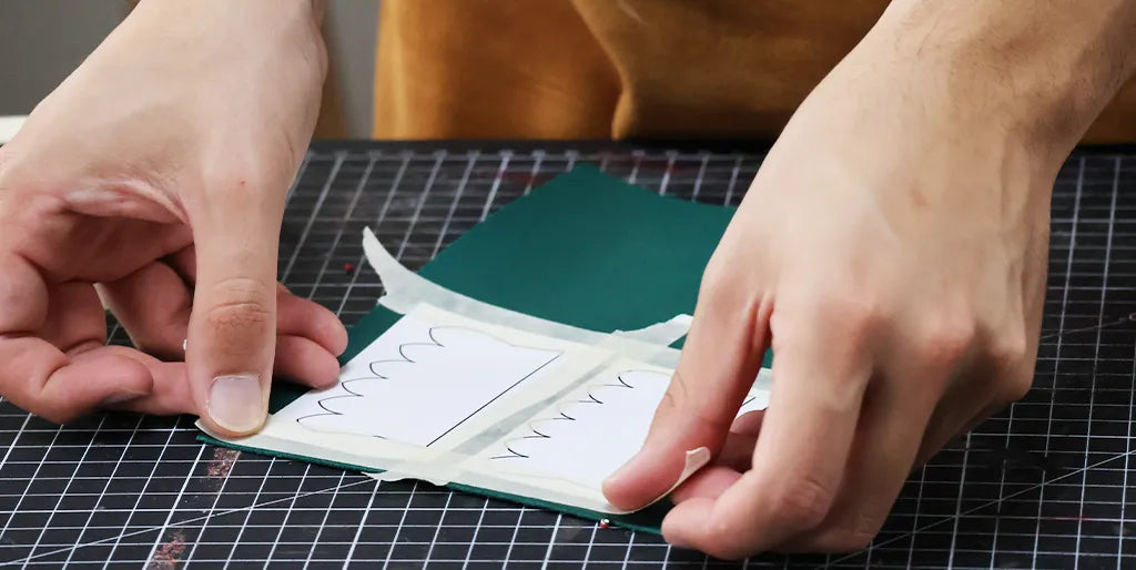 glue the pattern to the leather