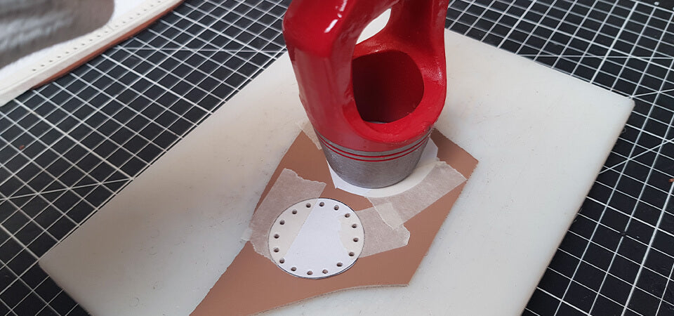 Cut a circle from a leather scrap